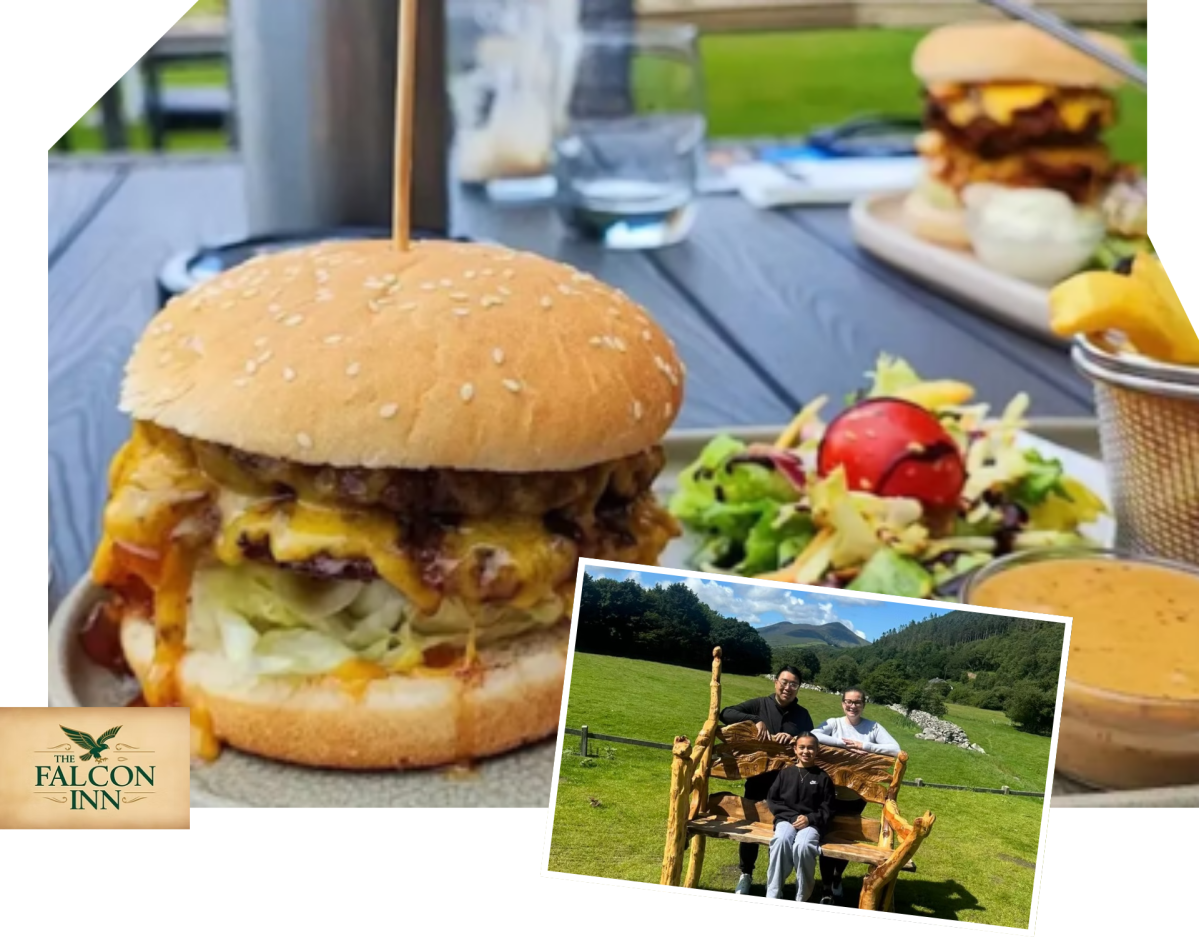 Cheeseburger and salad on a table, and a photo of three people sitting outdoors by mountains.